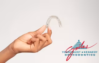 hand holding clear aligner